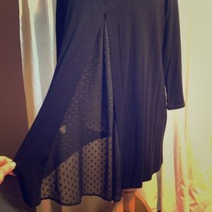 Black shirt with flowing sheer back.